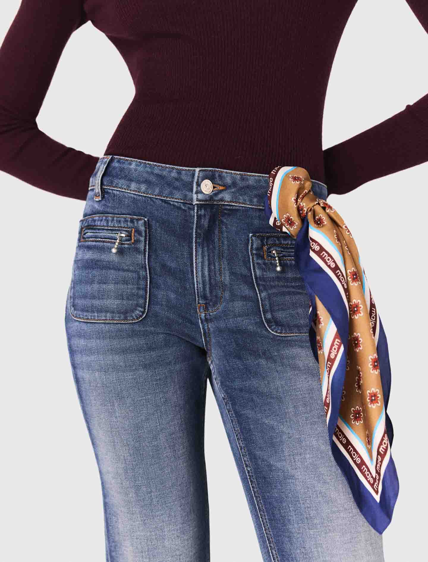 Pantalones vaqueros bootcut con bolsillos con cremallera