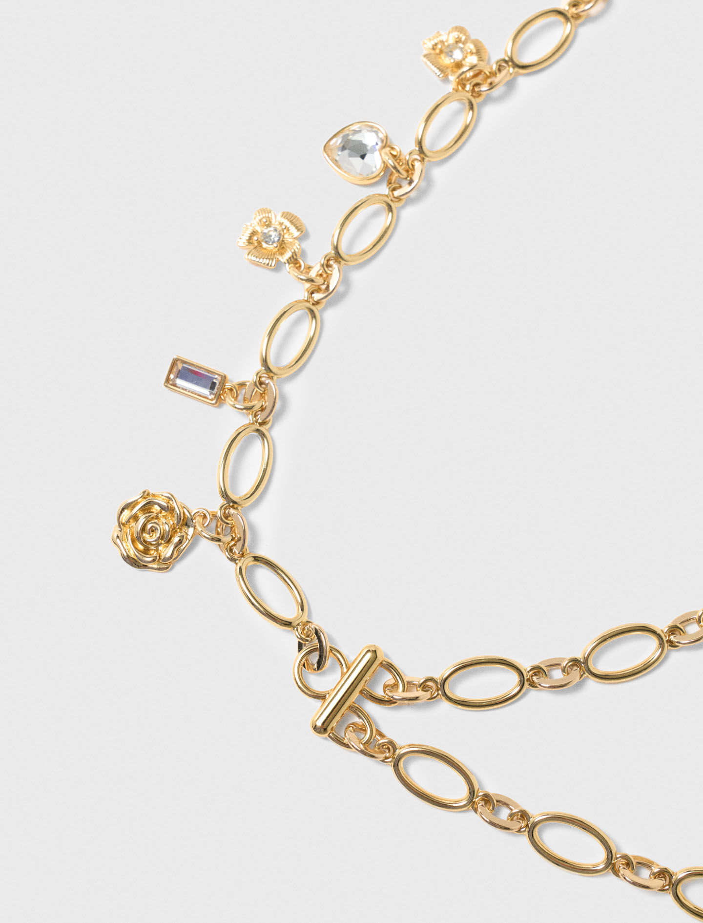 Cinturón de doble cadena con charms